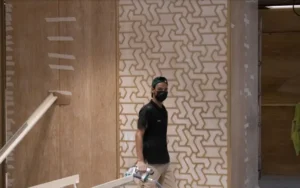 Fitting the feature wall at the Two Seasons Hotel in Dubai. The man with the spray gun is on our own payroll.